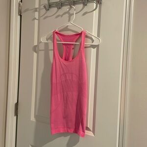 Pink lululemon size 2 swiftly tank. Hip length. Like new.